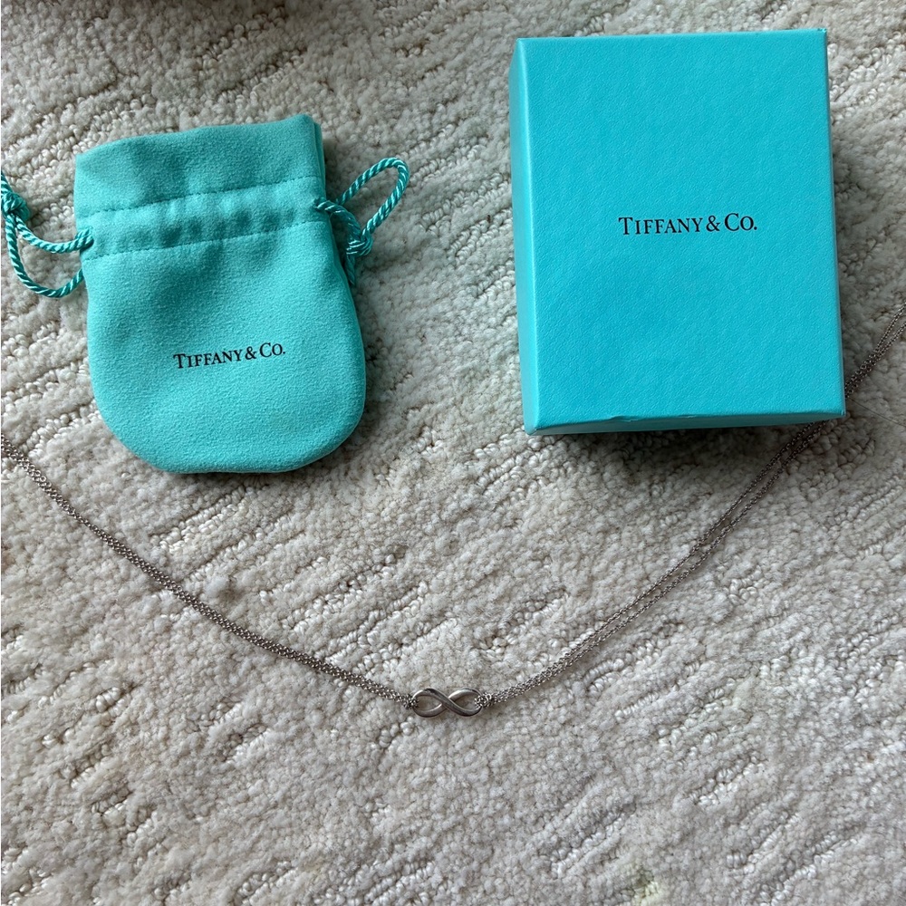 Tiffany & Co. Silver Infinity Pendant with Blue Pouch